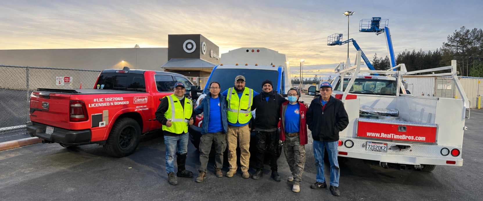 The Real Time Bros team together with their service vehicles